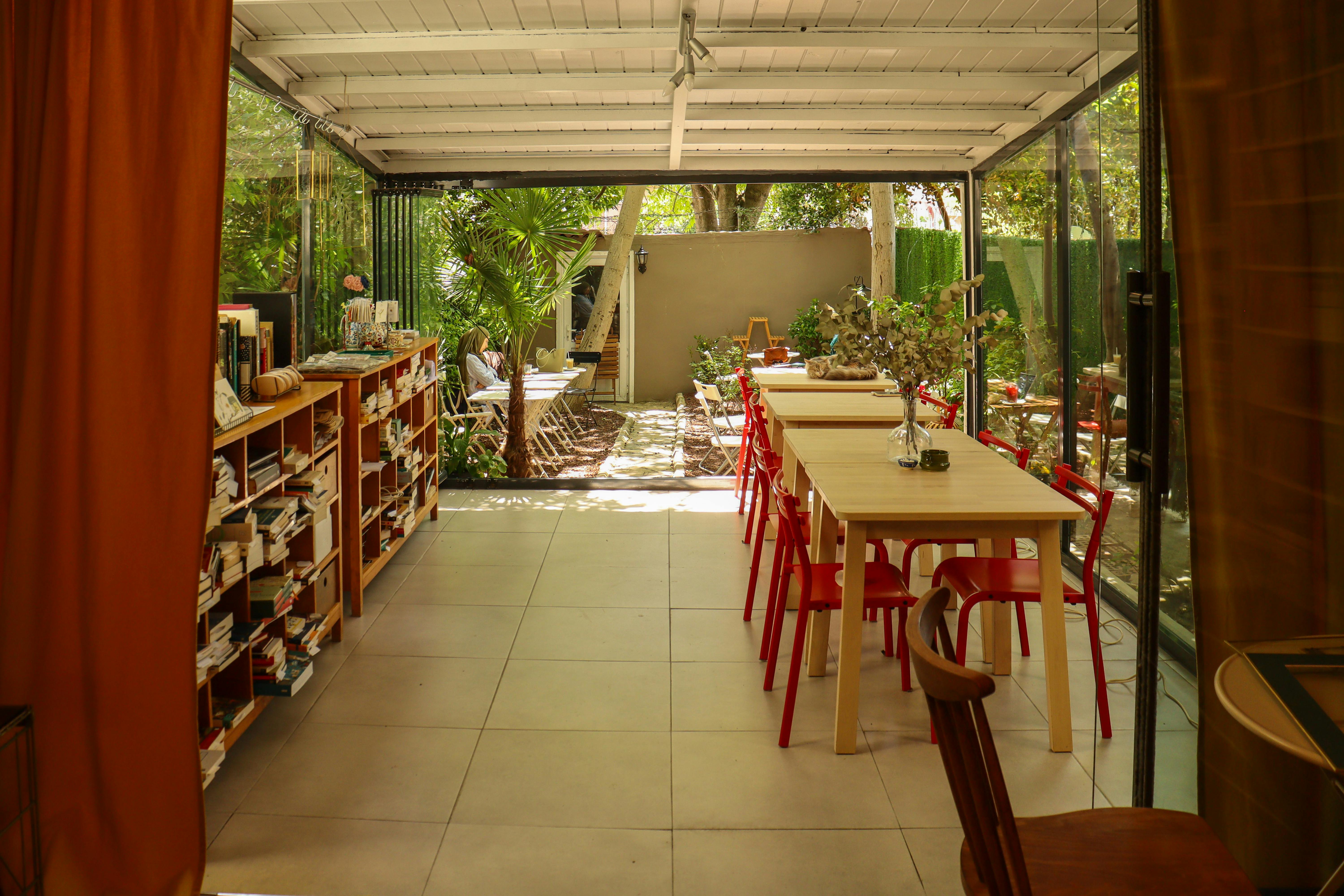 Cozy Indoor-Outdoor Reading and Dining Space · Free Stock Photo