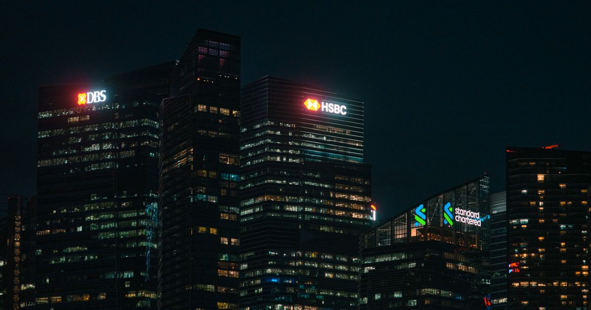 A financial district skyline at night, representing the institutions collectively referred to as smart money
