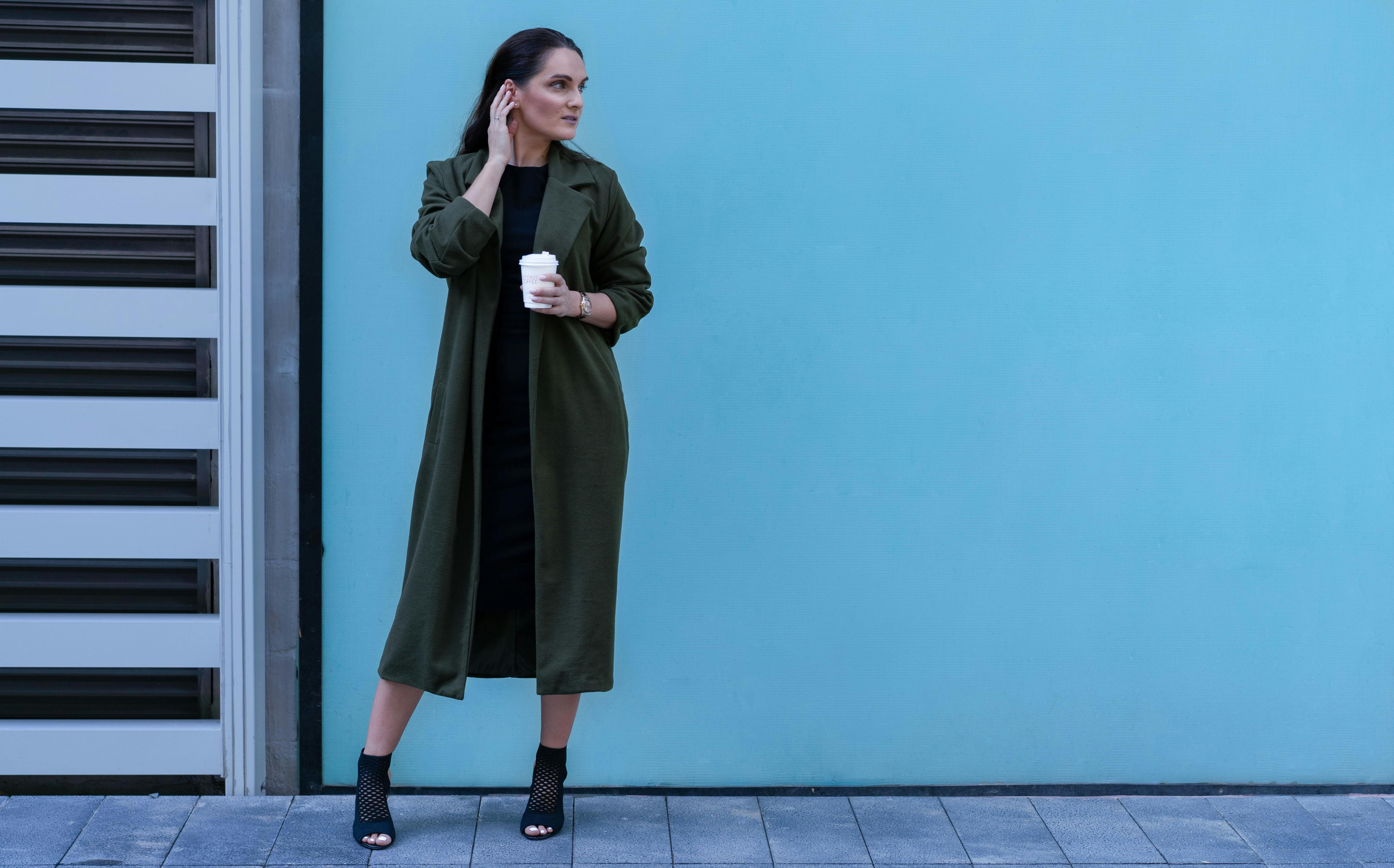 Photo Of Woman Wearing Green Coat · Free Stock Photo