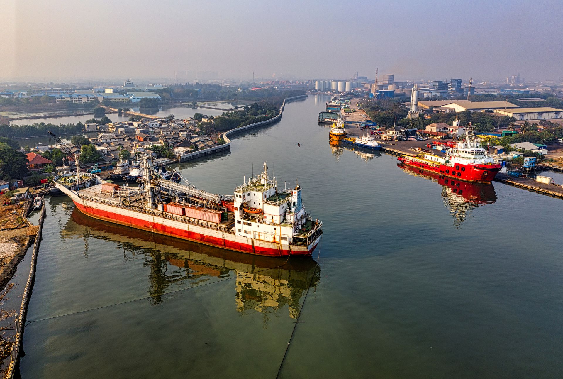 Aerial view of an oil tanker docked at an Asian port