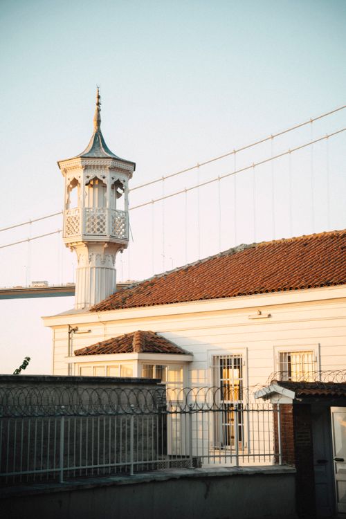 Free Charming historic building near a bridge, captured during a serene sunset. Stock Photo