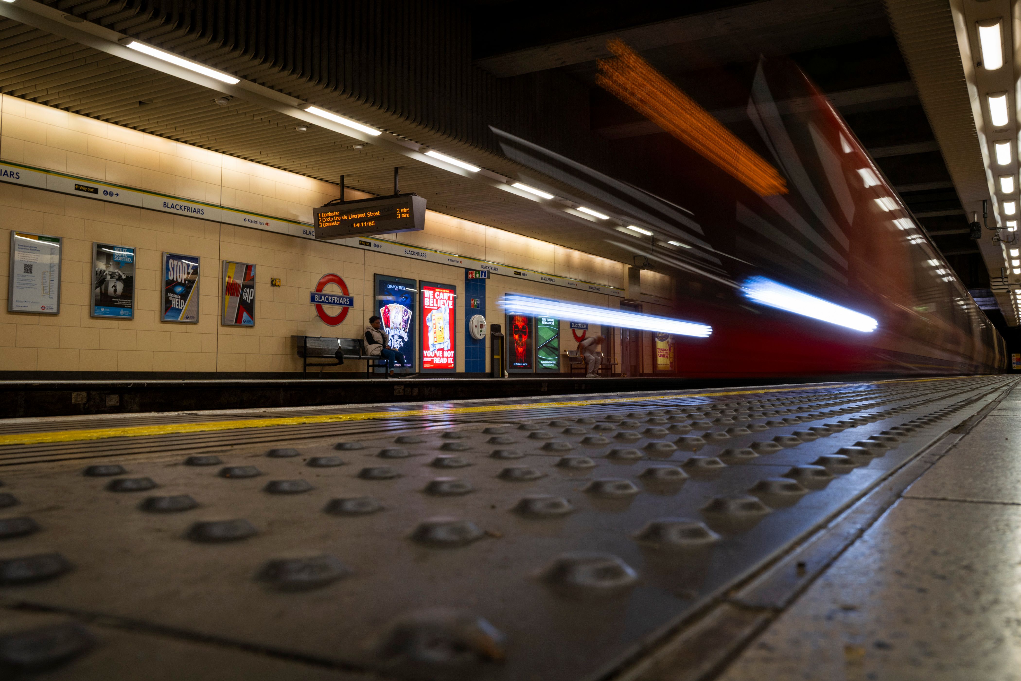 Busy platform of a London Underground (Tube) station, showing connectivity
