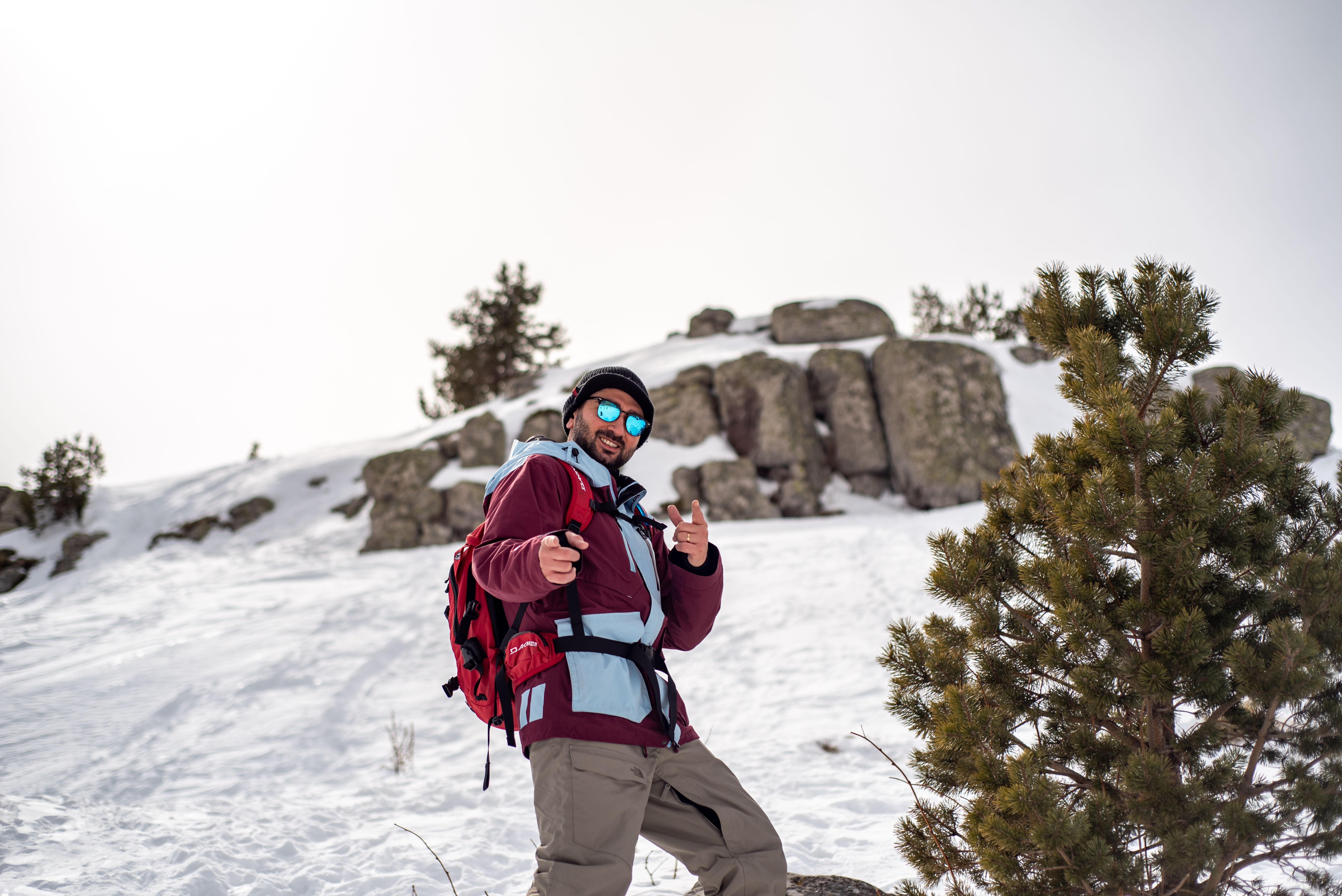 A skier enjoying a snowy mountain adventure, embracing the winter season with ski gear.