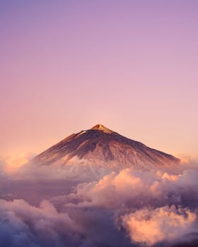 Photo Of Mountain During Dawn with the Quote "Freedom is the open window through which pours the sunlight of the human spirit and human dignity." written on it and have average color value #B78B9A