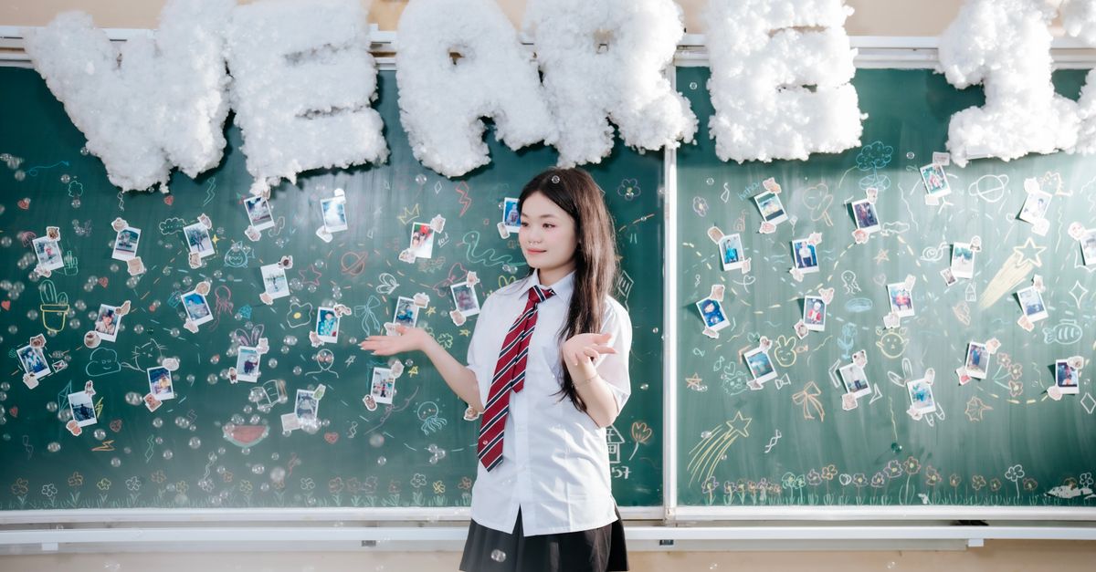 Classroom Graducation Student Celebrating Graduation in Classroom Setting · Free Stock Photo