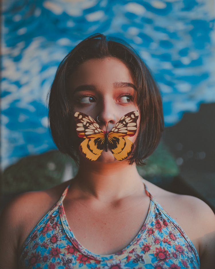 Photo Of Woman With A Butterfly On Her Mouth