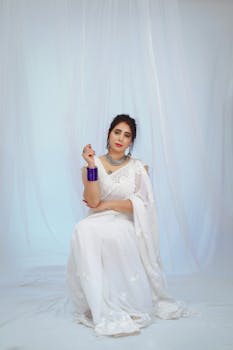 Nandini Gupta, Miss World 2025 contestant, dazzles in gold and pearls during the top 8 announcement.  Beauty pageant glamour.