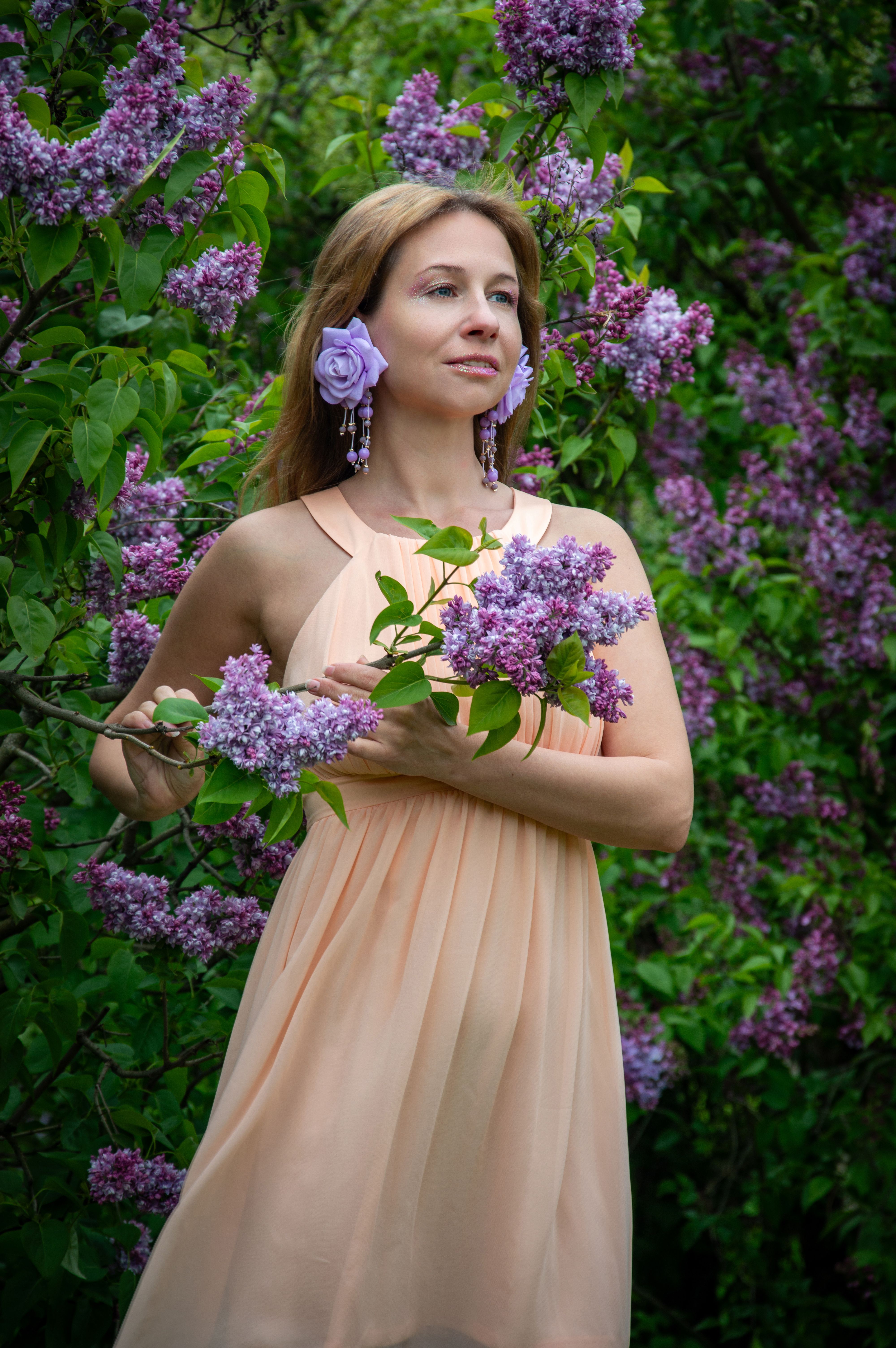 Woman in Floral Dress Among Blooming Lilacs · Free Stock Photo