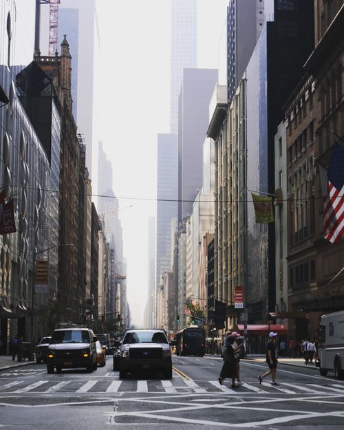 Free Crowded New York City street scene with skyscrapers and iconic yellow taxis. Stock Photo