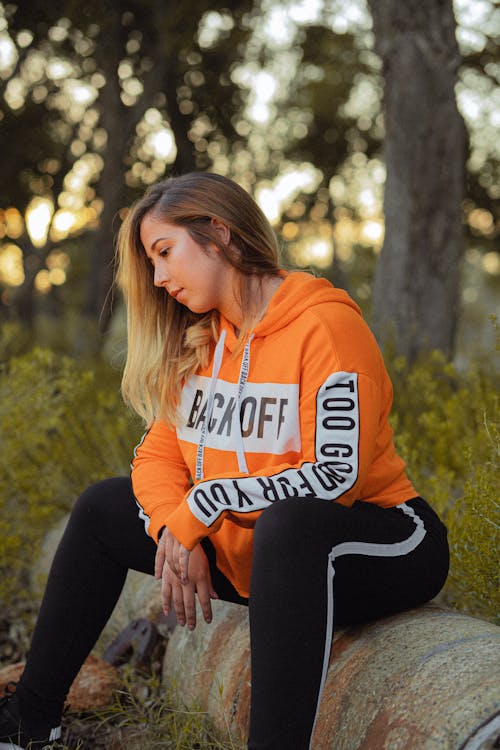 Free Photo Of Woman Wearing Orange Hoodie Stock Photo
