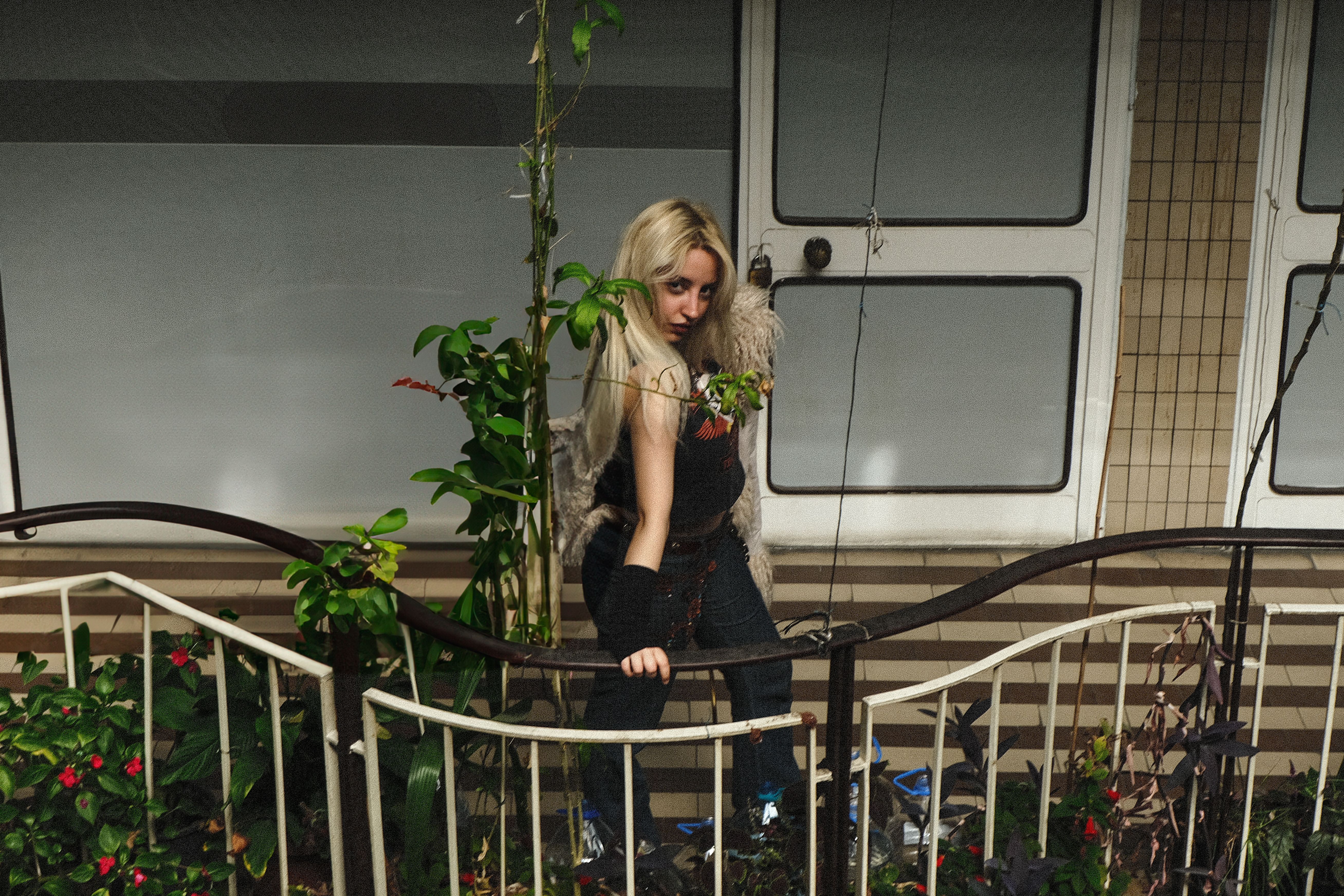Stylish Woman Posing Outdoors in Urban Setting · Free Stock Photo