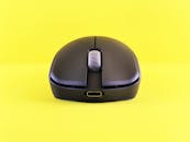 Sleek Wireless Mouse on Vibrant Yellow Background