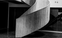 A concrete spiral stair in monochrome. Photo by Peter Caretta on Pexels