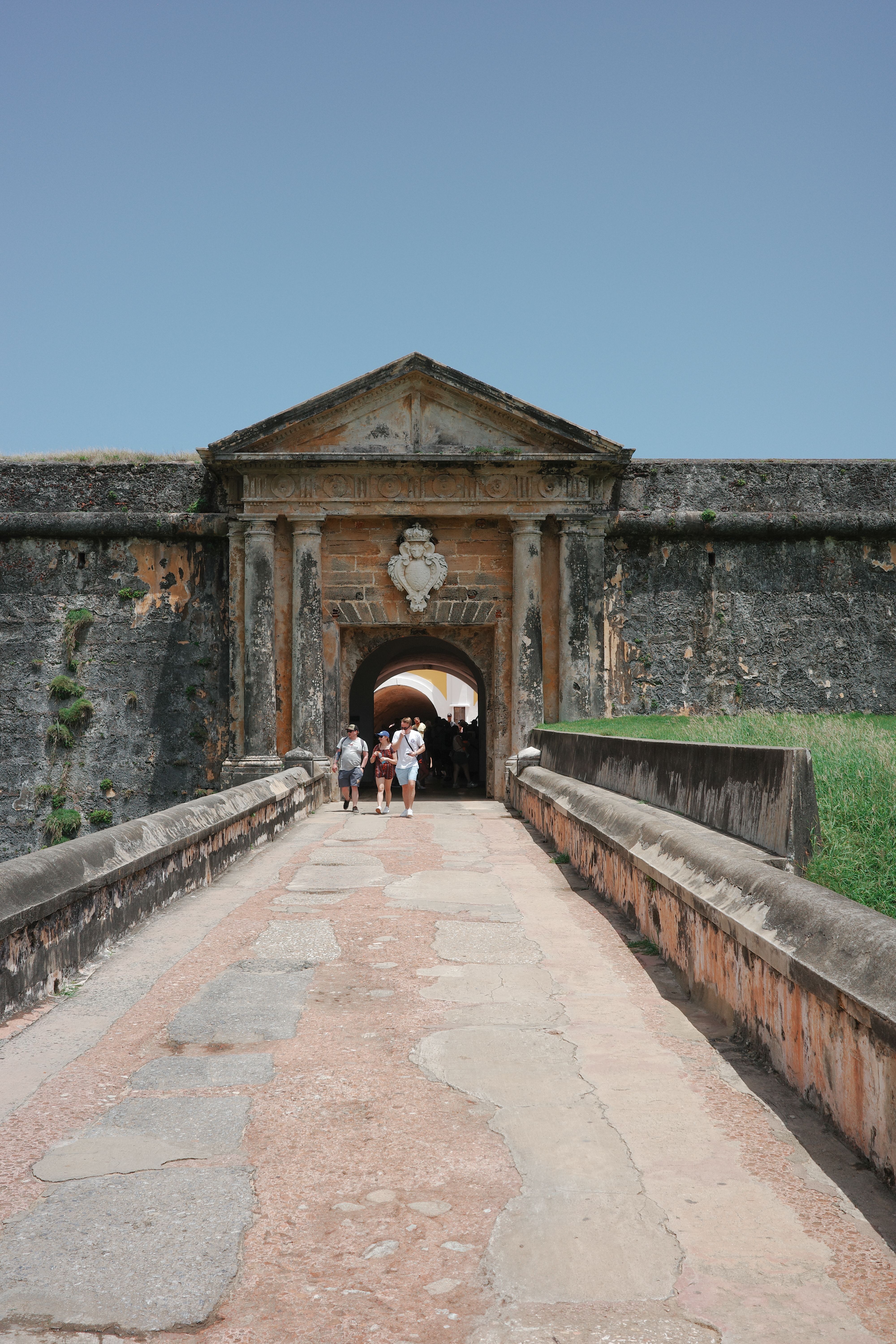 Tourists Walking Towards Historic Fort Entrance · Free Stock Photo