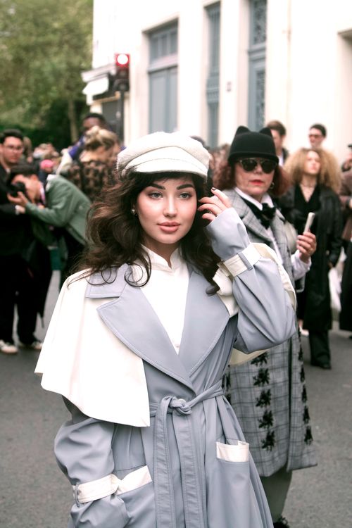 Free Stylish individuals at Paris Fashion Week, highlighting trend-setting street style. Stock Photo
