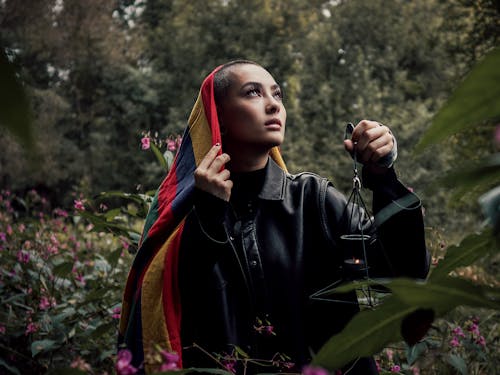 Photo Of Woman Holding Lamp