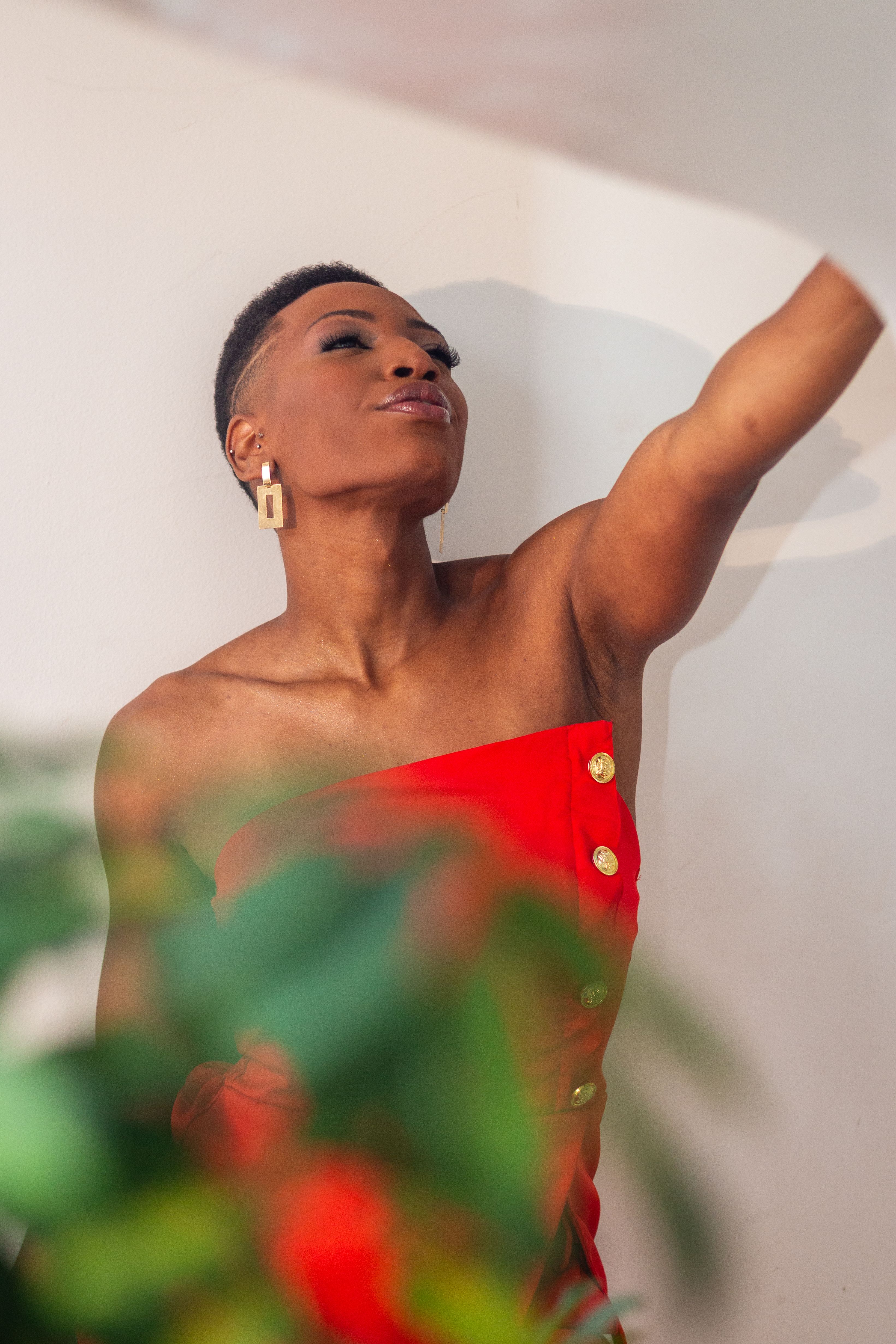 Elegant Woman in Red Dress Posing Indoors · Free Stock Photo