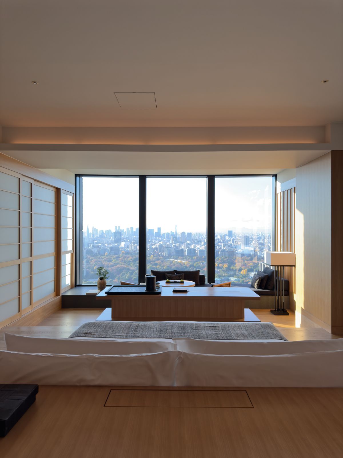 Hotel room with a large window overlooking the Tokyo skyline