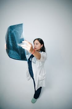 Medical professional examining an X-ray. High-quality healthcare imagery for clinical use.