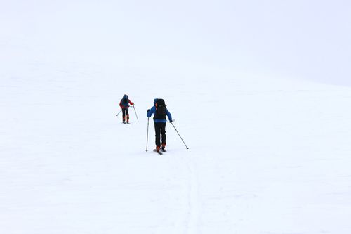Free Two skiers trekking in the snowy expanse of Jämtlands län, Sweden. Stock Photo