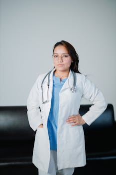 Portrait of a female doctor in a lab coat with a stethoscope, embodying professionalism and confidence.