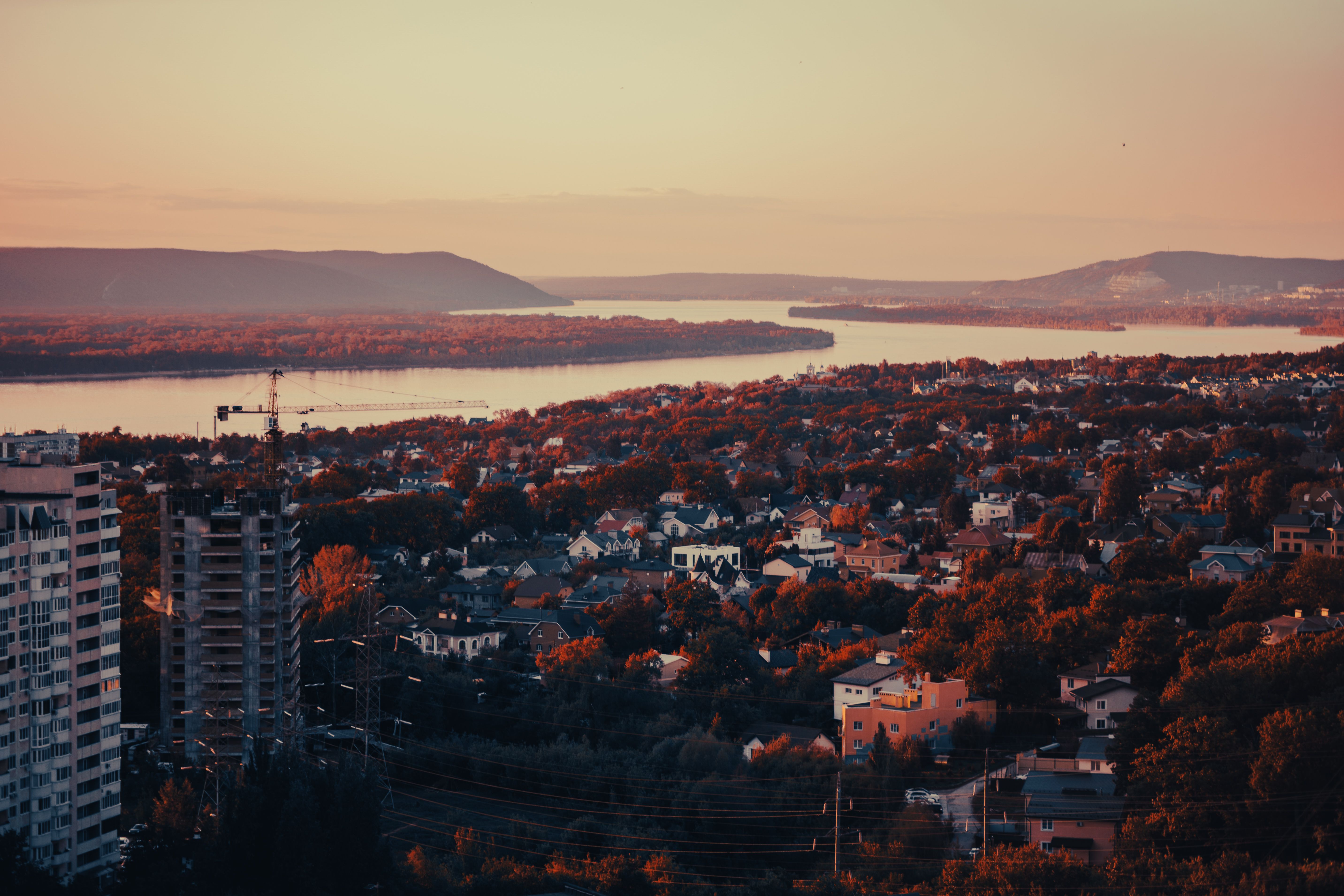Scenic Sunset View Over Riverside Town · Free Stock Photo