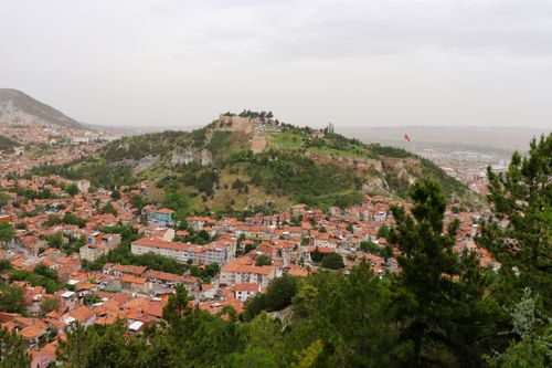 Free Scenic aerial view of Afyonkarahisar Castle surrounded by lush greenery and urban landscape. Stock Photo