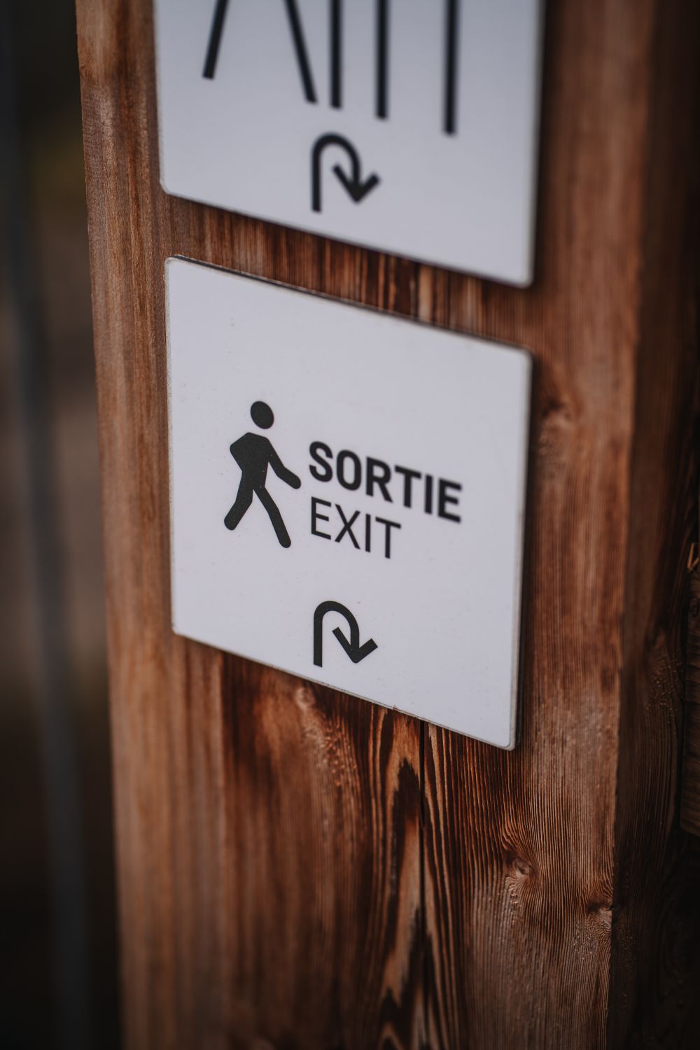 Sortie Sign Printable Wooden Post with Sortie Exit Sign · Free Stock Photo