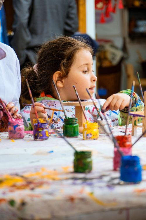 Young Girl Engaged in Colorful Art Activity · Free Stock Photo