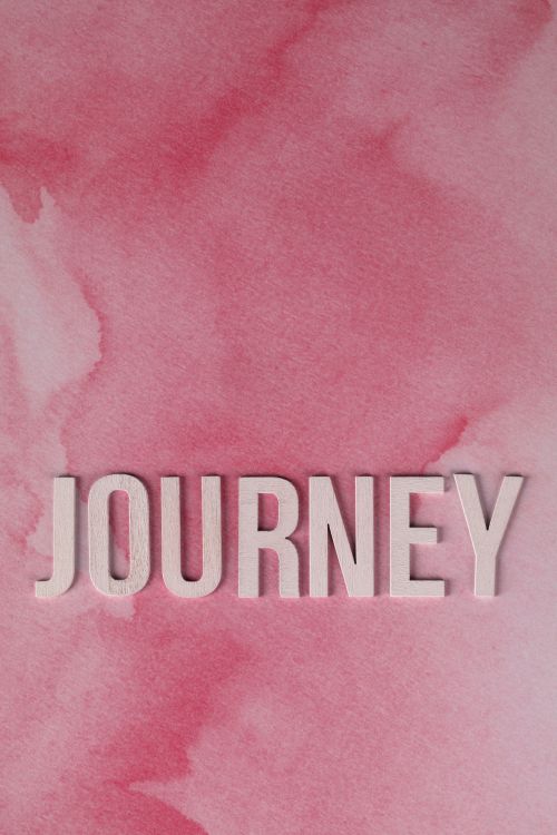 Free Motivational journey text on a pink watercolor background, ideal for creativity. Stock Photo