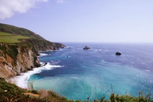 Free Breathtaking coastal scene in Monterey, California with cliffs, ocean waves and a clear blue sky. Stock Photo