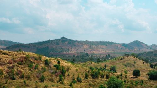 Free Beautiful view of rolling hills under a bright sky in Cambodia, showcasing natural beauty and tranquility. Stock Photo