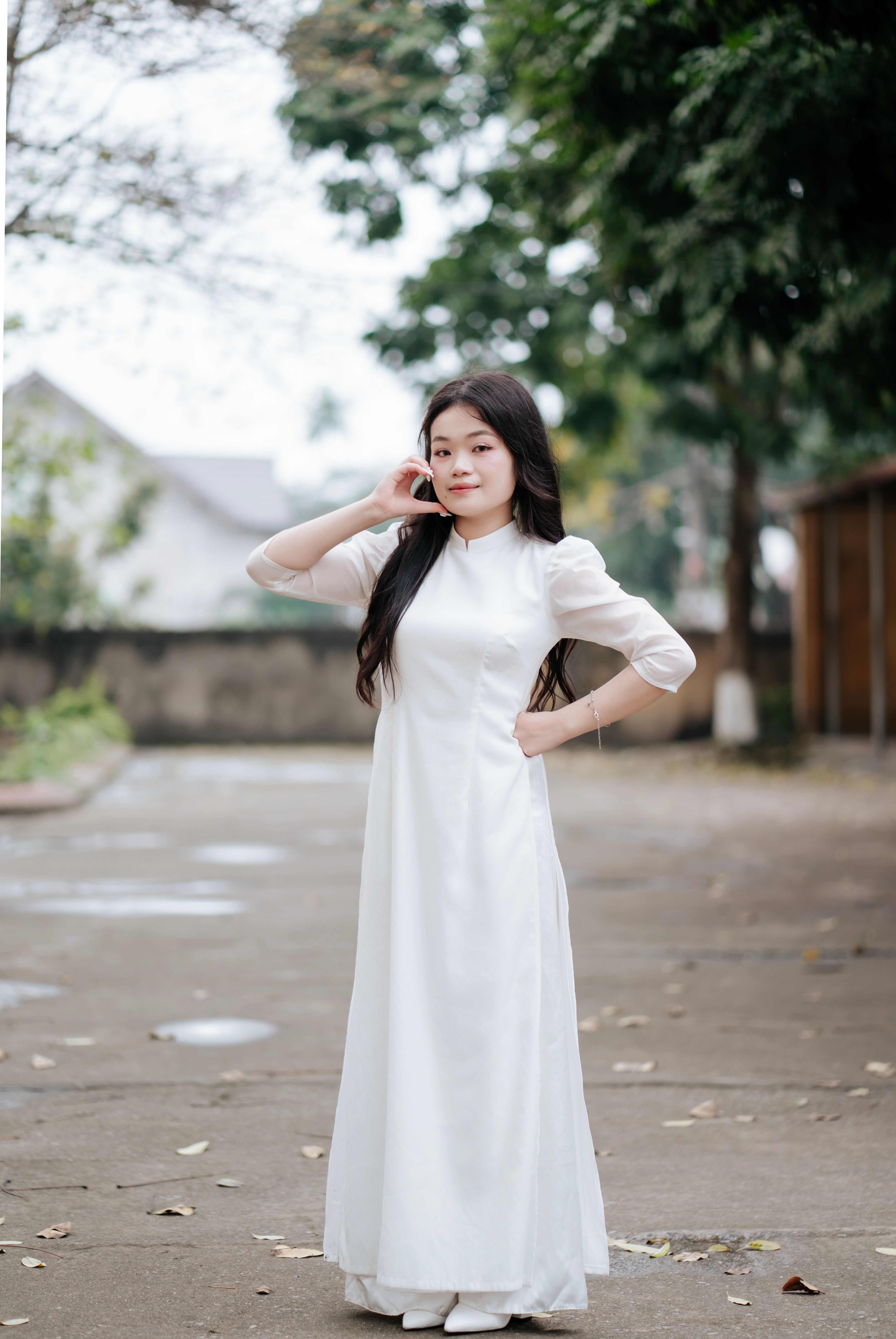 Young Woman in Traditional White Dress Outdoors · Free Stock Photo