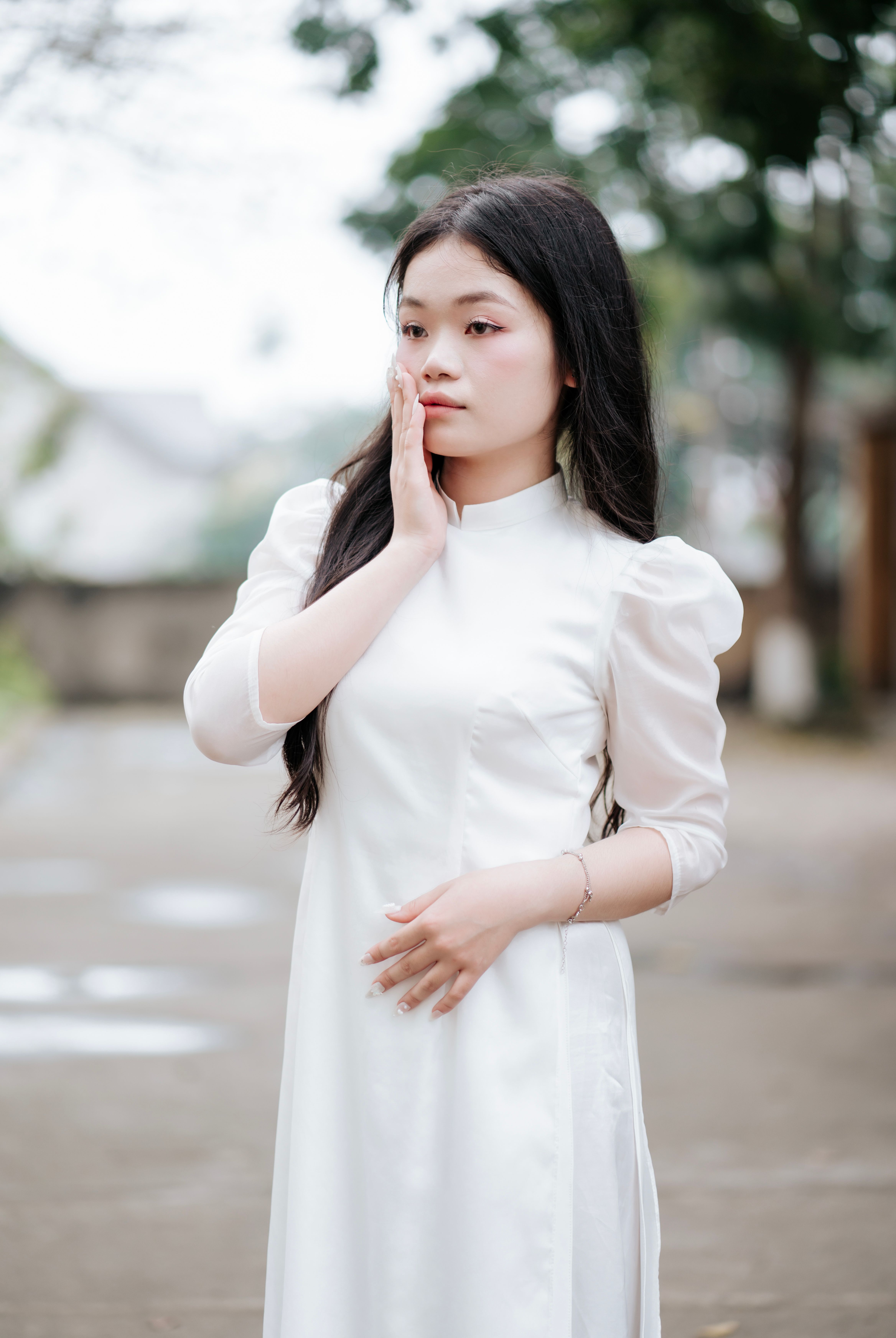 Young Woman in White Traditional Dress Outdoors · Free Stock Photo