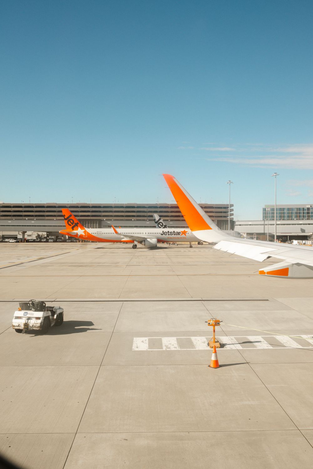 Jetstar Aircraft at Melbourne Airport Terminal · Free Stock Photo