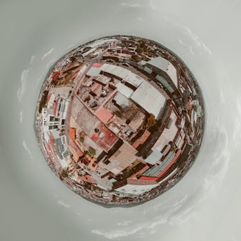 Aerial photograph of a cityscape in a spherical format, showcasing abstract urban design.