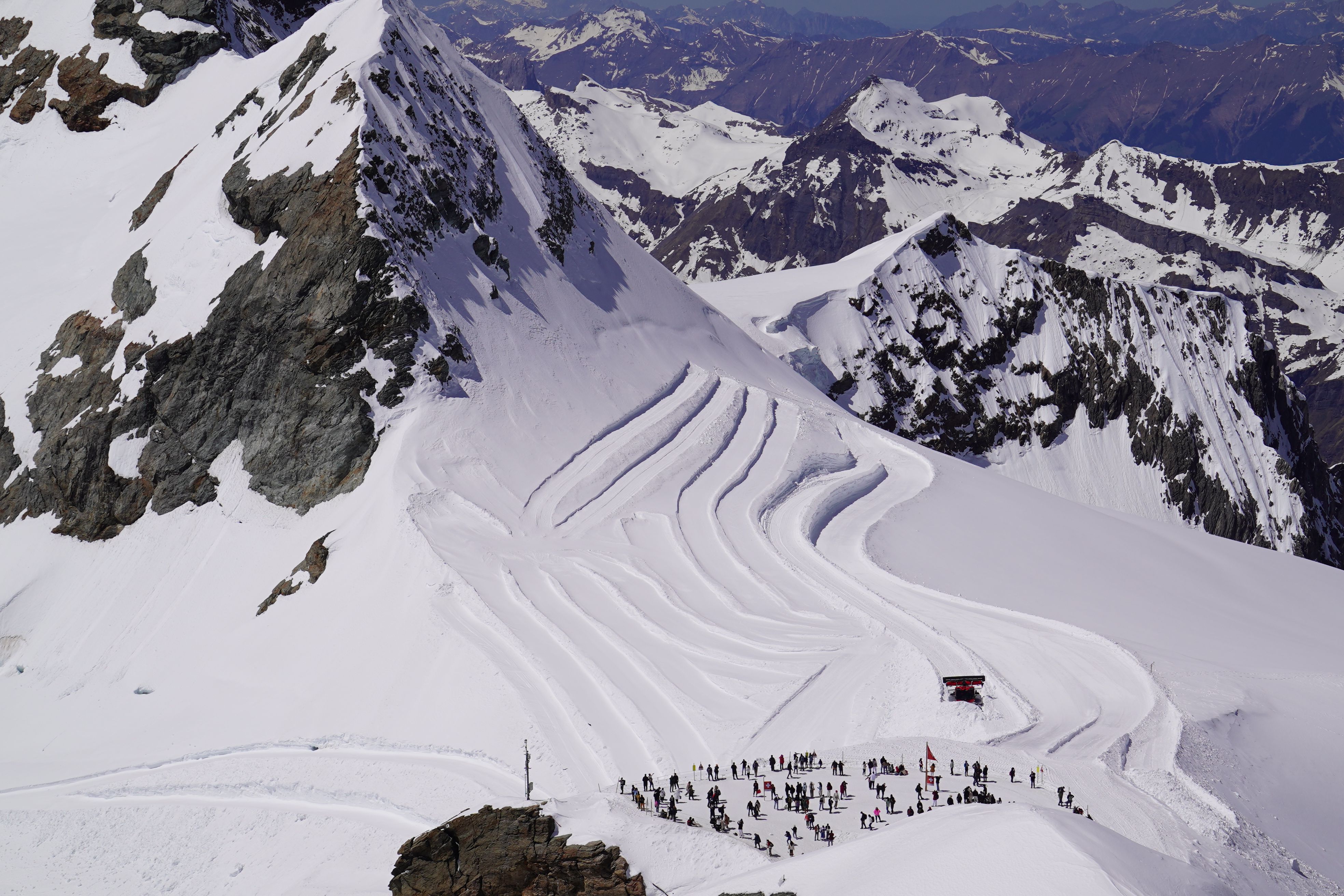 Aerial View of Snowy Mountain with Skiing Trails · Free Stock Photo
