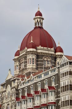 Elegant view of the Taj Mahal Palace Hotel with its majestic red dome in Mumbai, India.