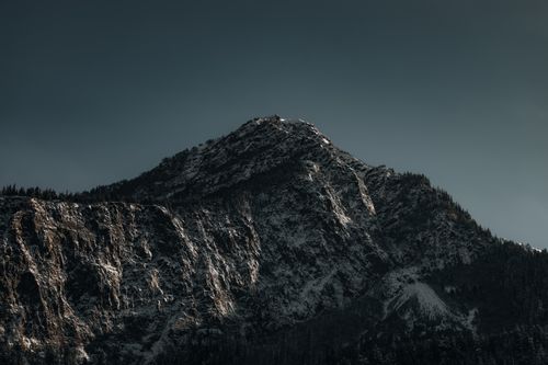 Free Stunning image of a snow-capped mountain peak under a clear sky, capturing nature's grandeur. Stock Photo