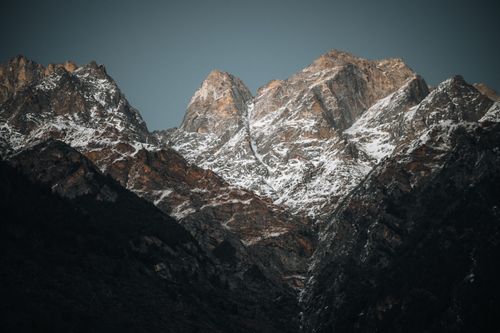 Free Breathtaking view of snow-capped Himalayan peaks during twilight, showcasing rugged and majestic landscapes. Stock Photo