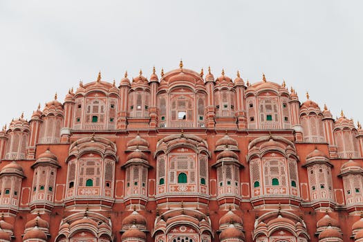 Hawa Mahal's iconic pink facade showcases stunning Rajasthani architecture in Jaipur, India.