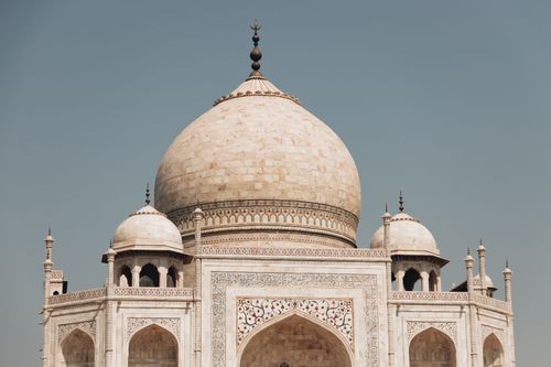 Free Close-up of the iconic Taj Mahal dome against a clear blue sky. Stock Photo