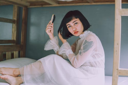 Photo Of Woman Holding Hair Brush