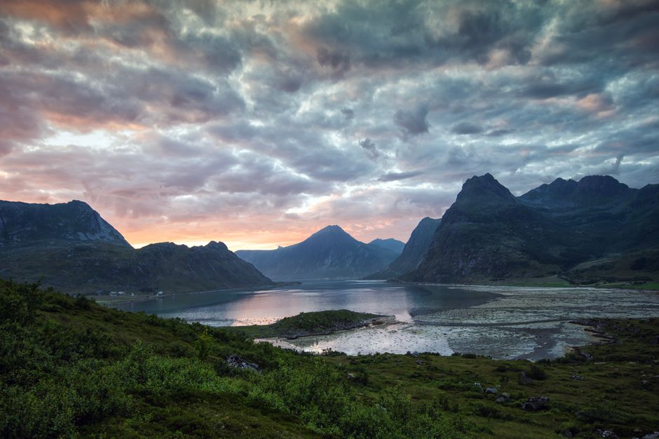 Stunning Tromsø: Fjord Adventure Tour with Wildlife and Lunch Review 2026 - Captivating sunset view over a serene fjord surrounded by majestic mountains.