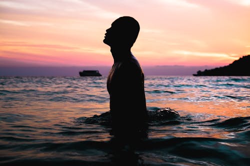 Free Silhouette Photo of Man on Water Stock Photo