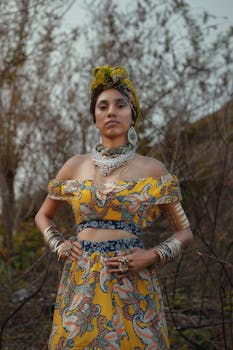 Confident woman in colorful outfit posing outdoors, showcasing elegant fashion and style.