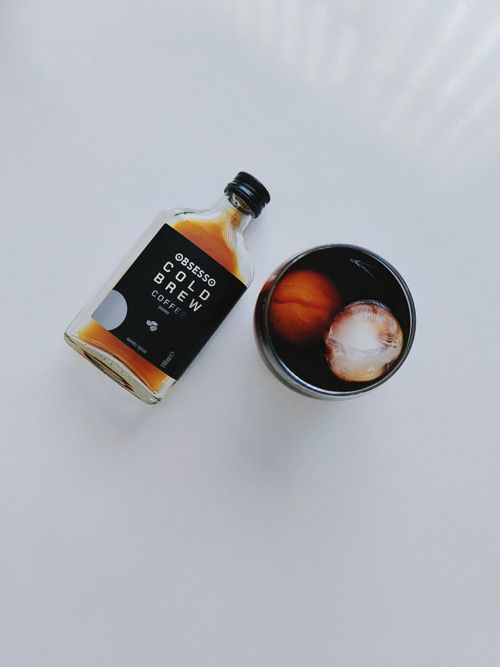 Free Refreshing cold brew coffee with ice cubes in a glass, perfect for a coffee lover's moment. Stock Photo