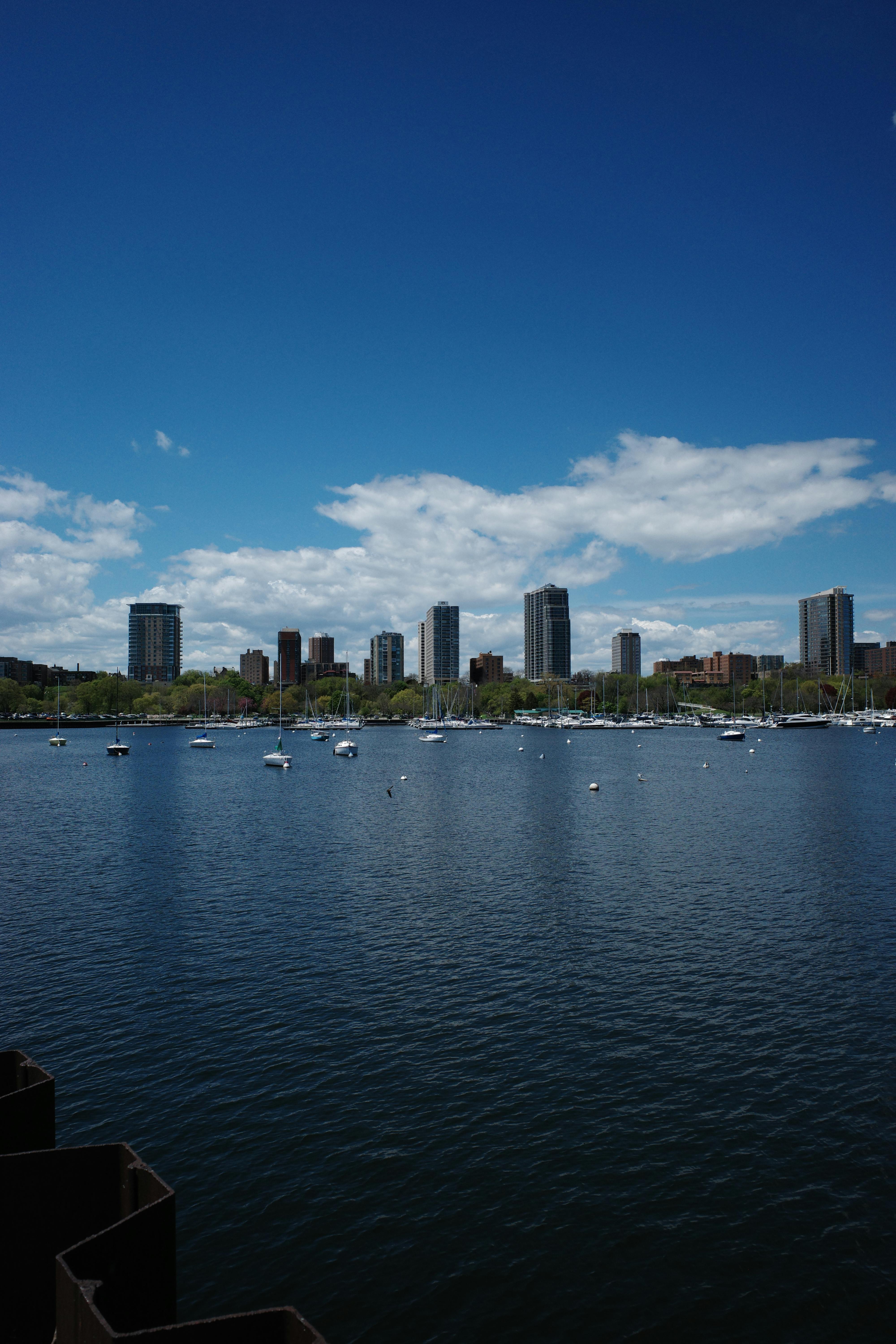 Milwaukee Wisconsin skyline with sailboats anchored on Lake Michigan waterfront on a clear summer day