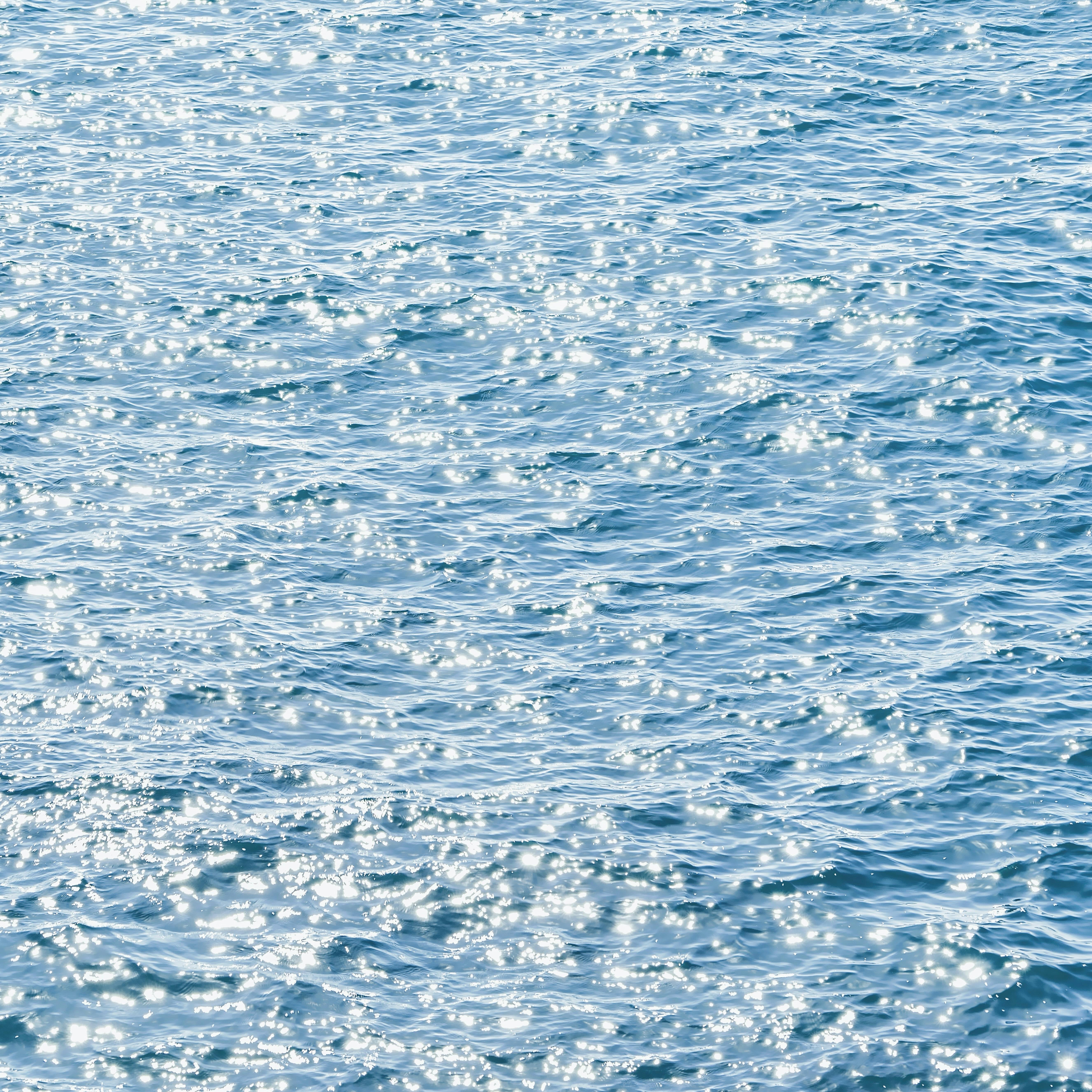 Miễn phí Cảnh tượng thanh bình với ánh sáng mặt trời lấp lánh trên bề mặt đại dương, tạo nên cảm giác êm dịu. Ảnh lưu trữ