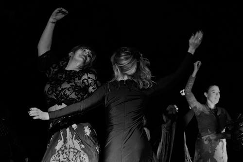 Free Grayscale Photography of Women Dancing Stock Photo